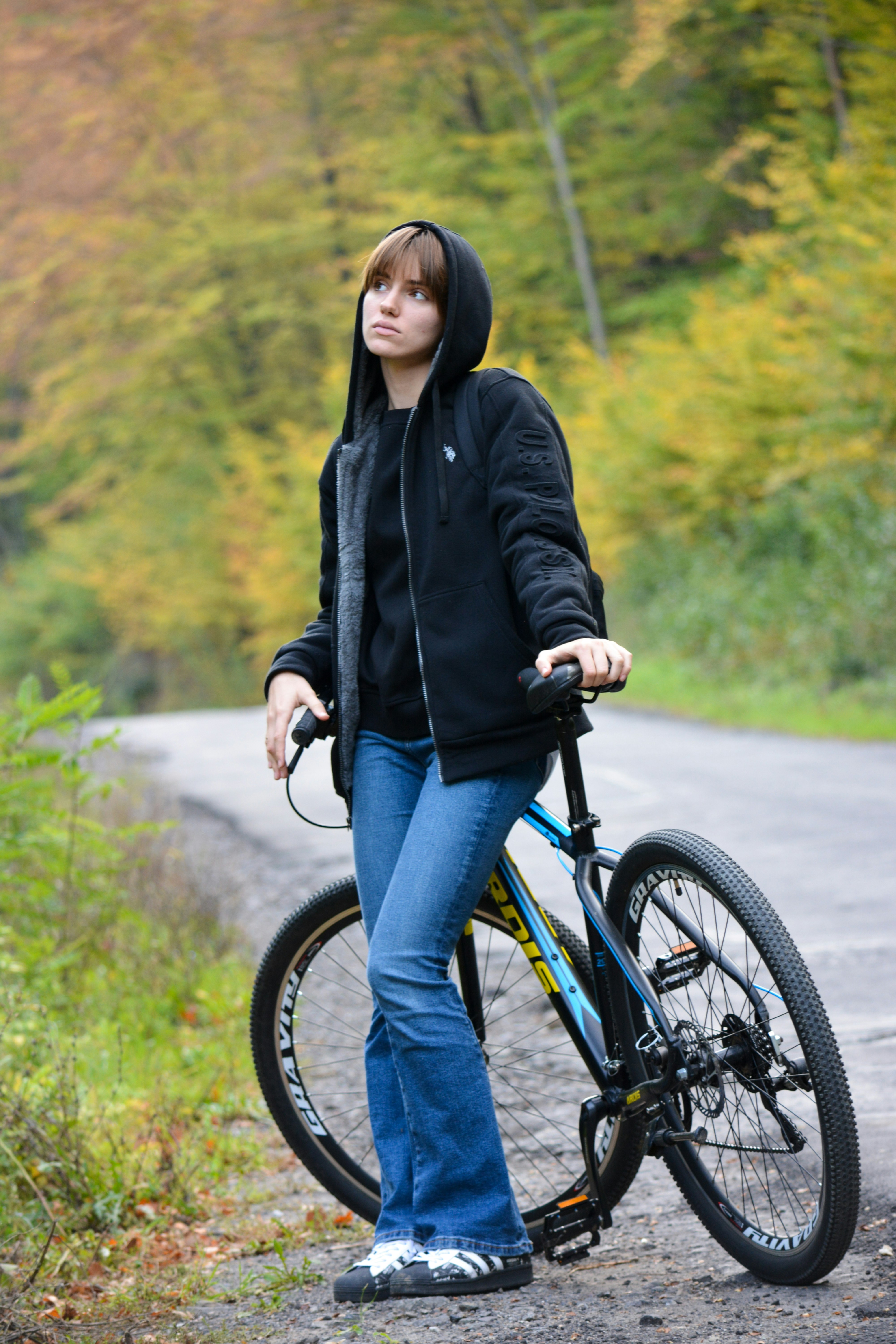 a person standing next to a bicycle