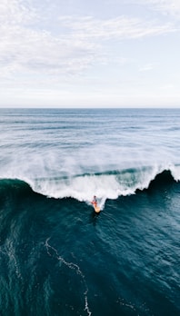a person surfing on a wave
