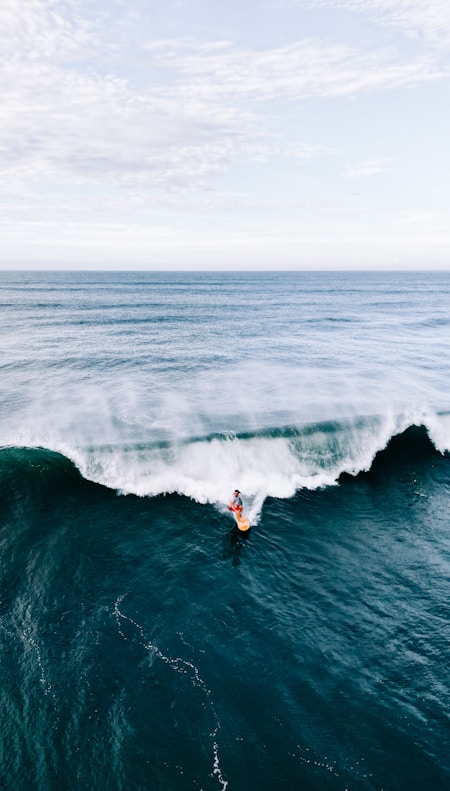 a person surfing on a wave