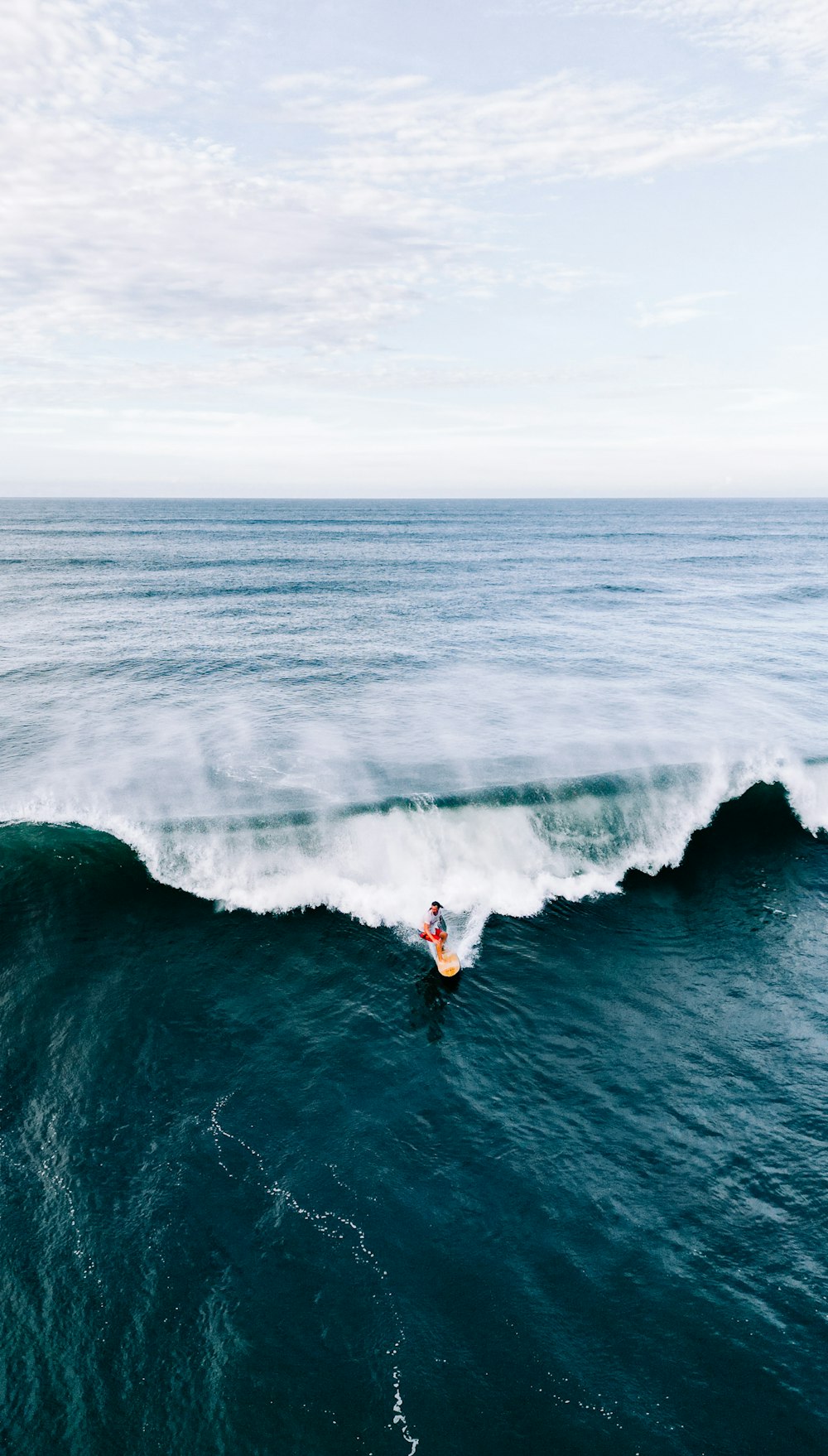 a person surfing on a wave