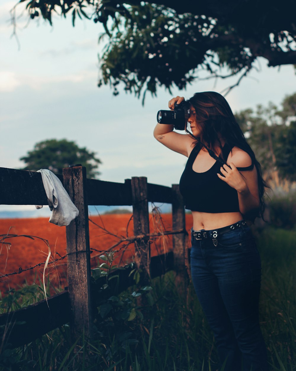 a woman taking a picture with a camera