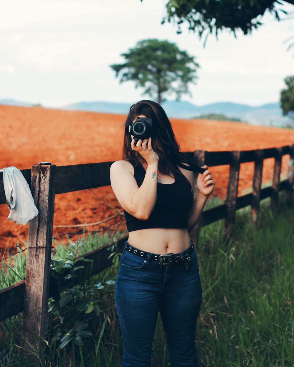 a woman with a camera in her hand