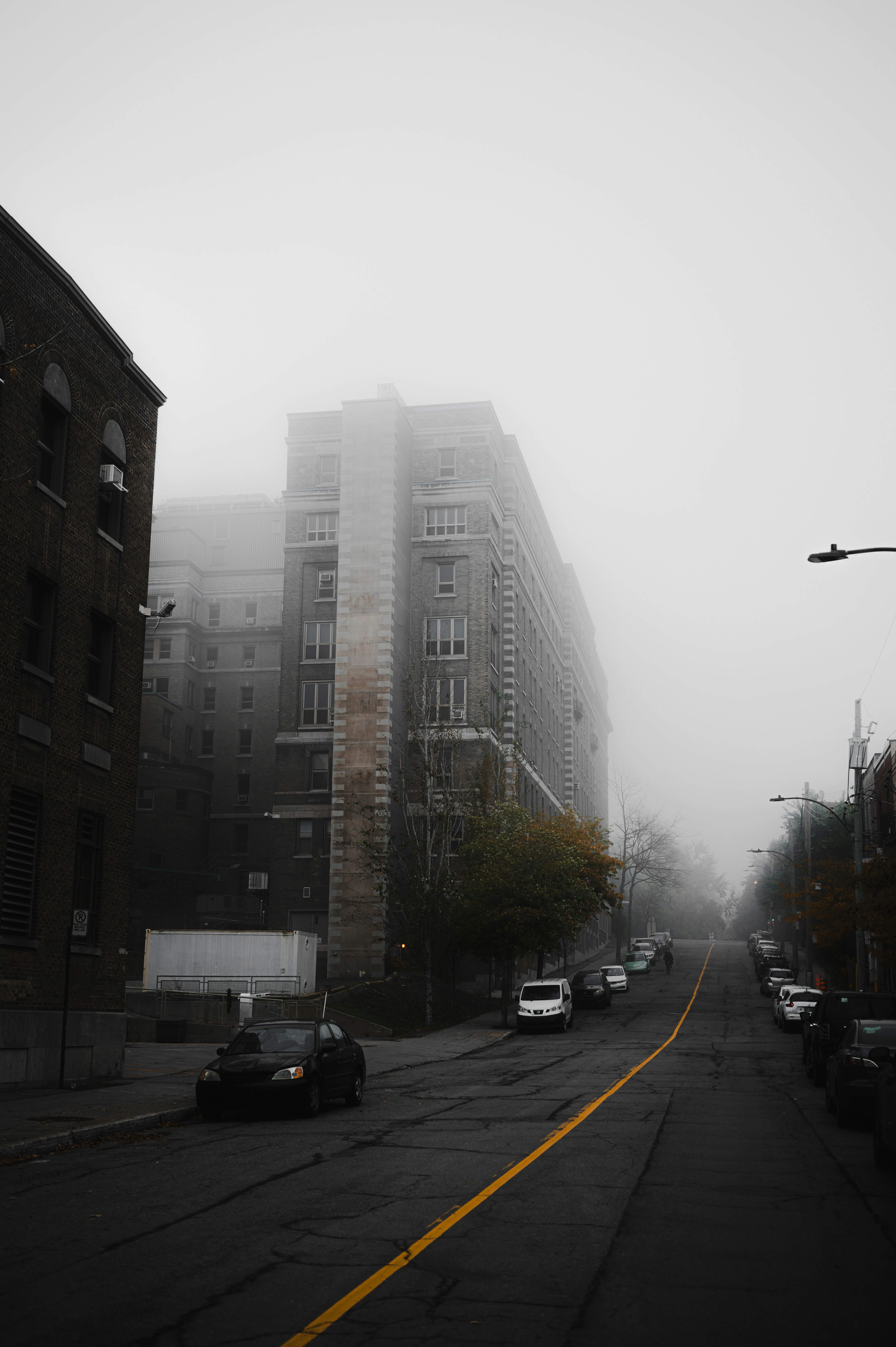 a street with cars and buildings on the side