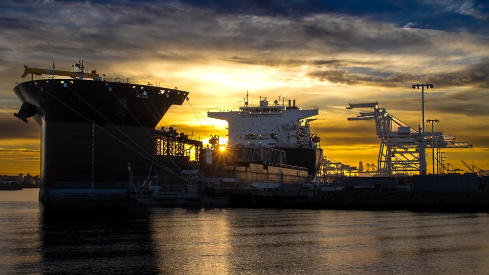 a couple of large ships at a dock