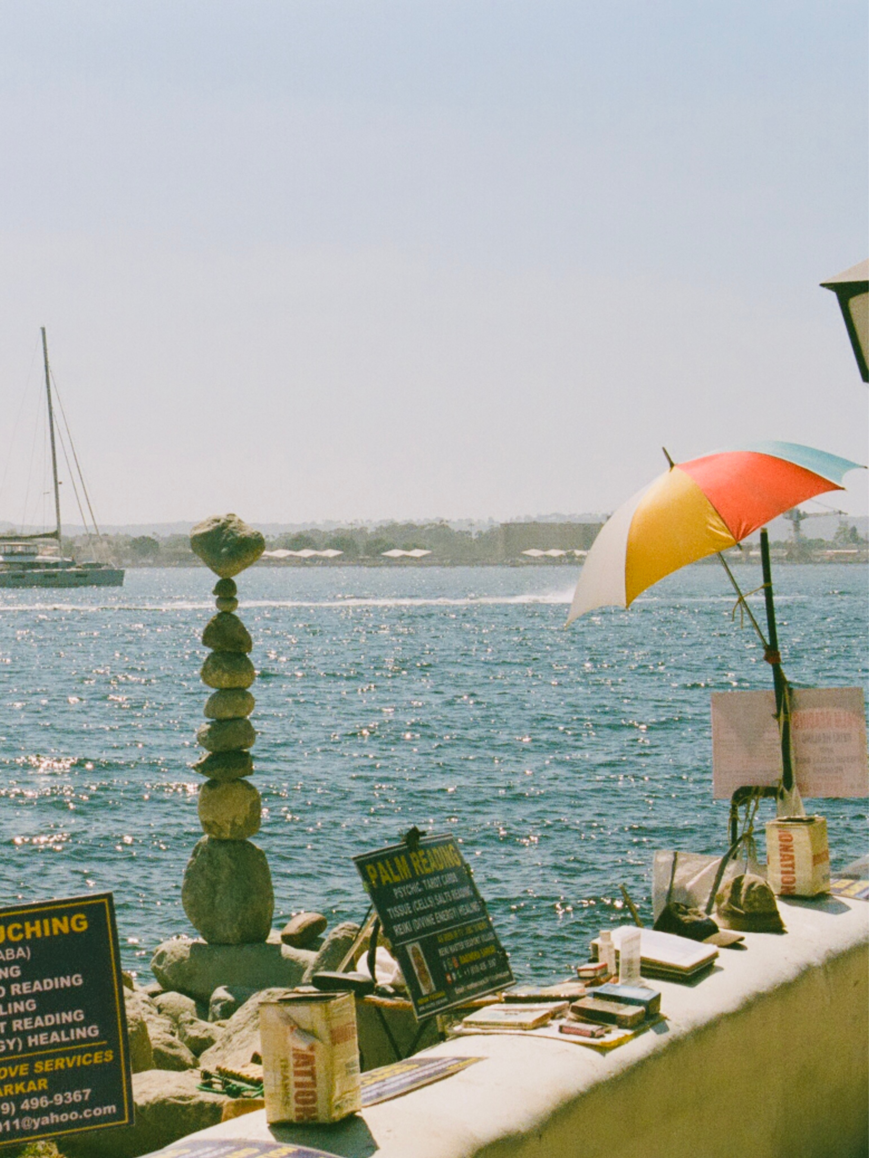a chair and umbrella by the water
