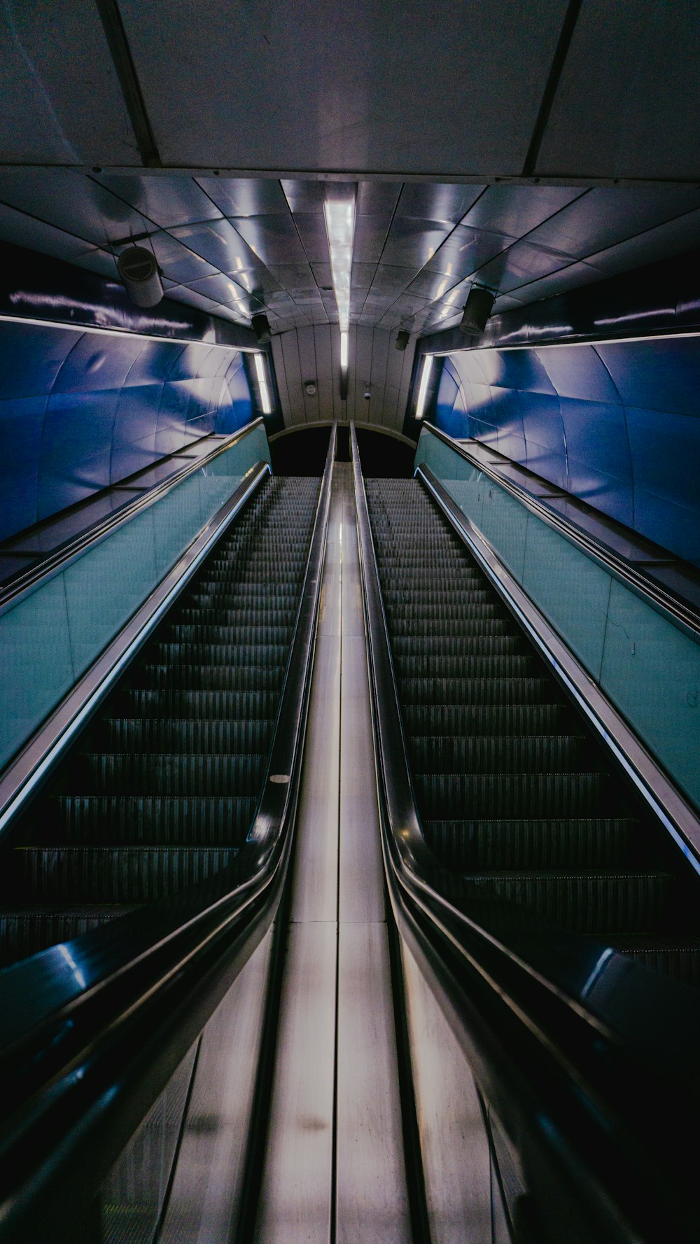 a long escalator in a building