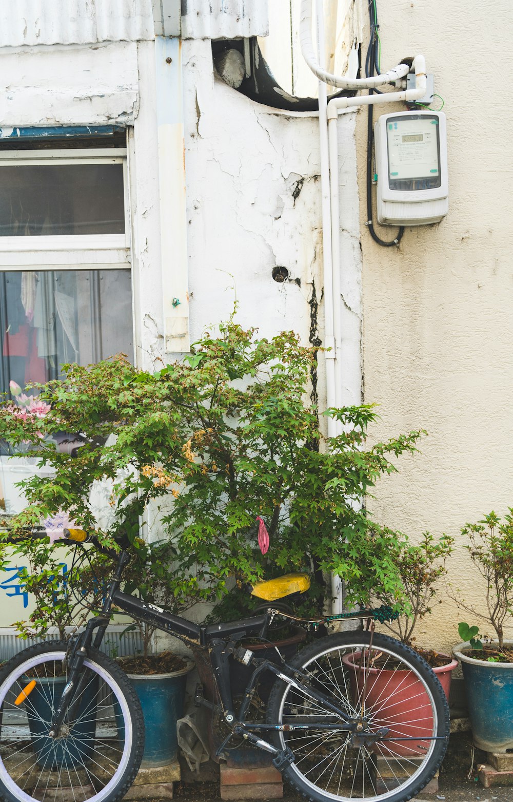 a bicycle parked next to a building