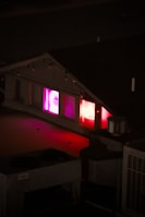 A rooftop party scene with people rocking nocturna apparel against a city skyline at night.