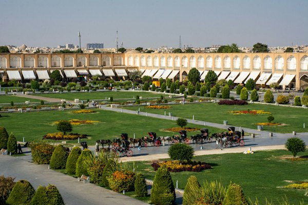 The gardens and carriages of Naqsh-e Jahan Square — Isfahan, Iran
