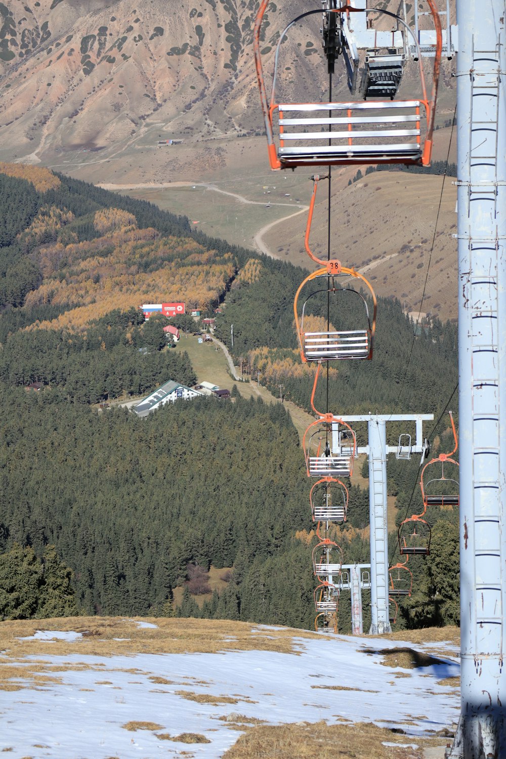 a group of roller coasters going up a hill