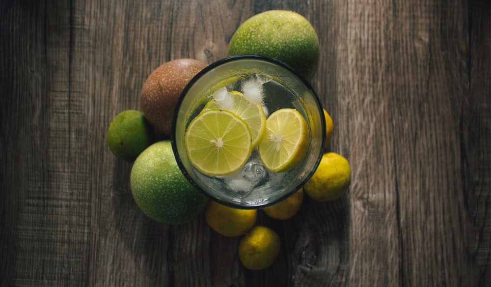 a bowl of lemons and limes