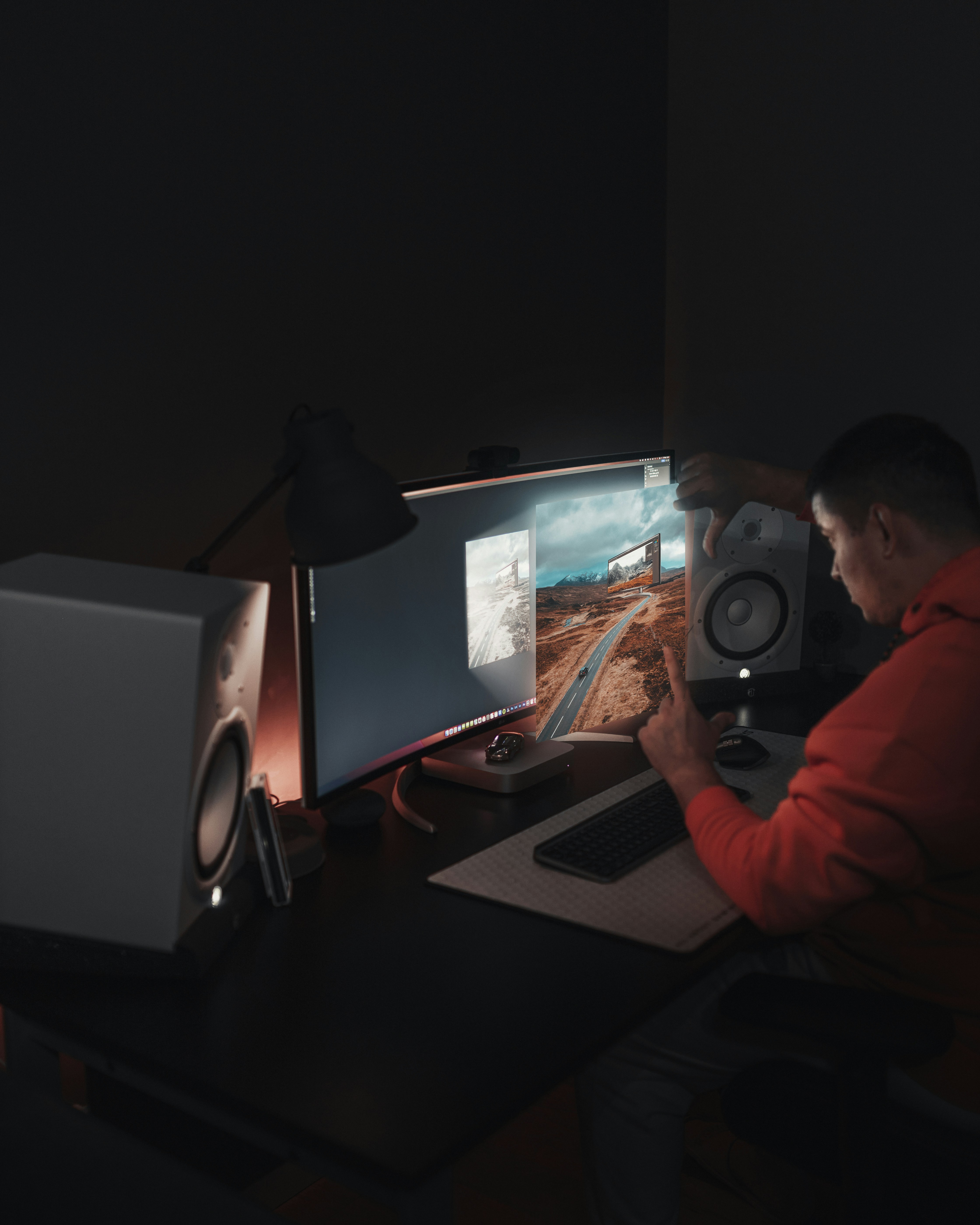 Man working on computer with studio monitors