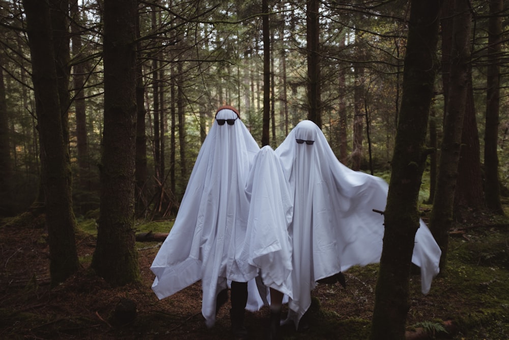 a group of white dresses in a forest