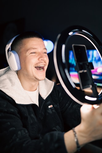 A person recording a voice message with a smile.