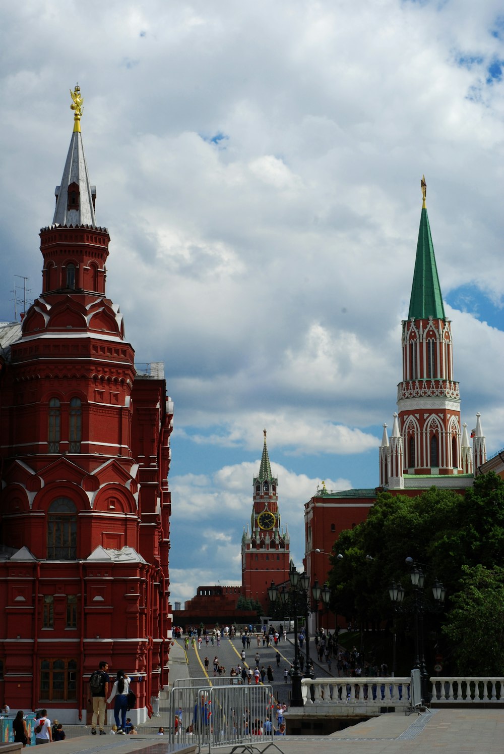 a group of buildings with towers with Moscow Kremlin in the background
