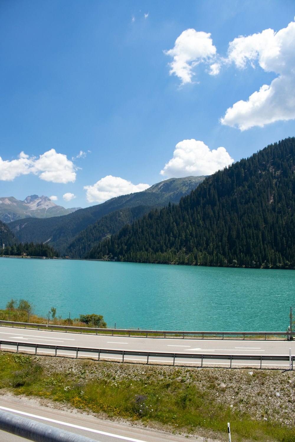 a body of water with mountains in the background