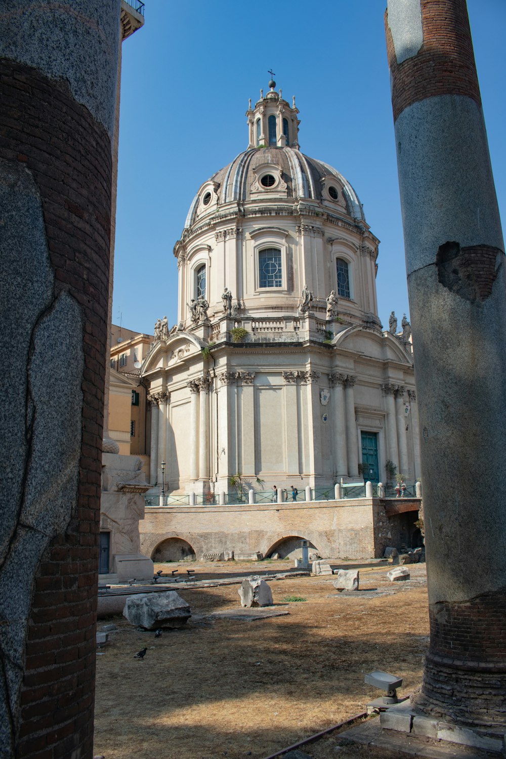 a building with a dome and columns