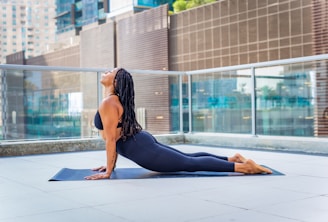 a woman sitting on a yoga mat