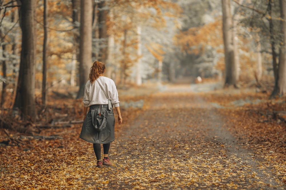 a person walking on a path in the woods