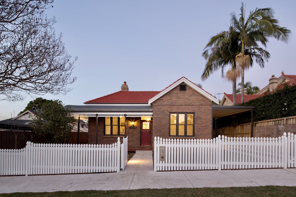 a house with a white picket fence