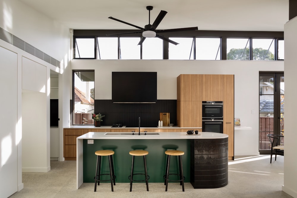 a kitchen with a bar stools