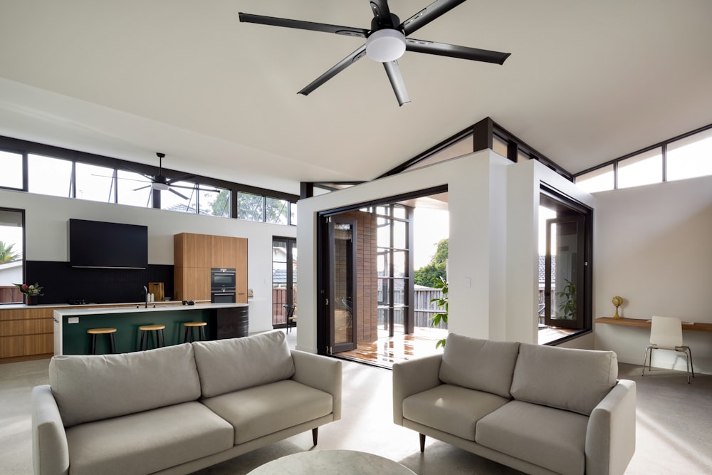 a living room with a large ceiling fan