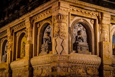 a building with statues on the walls