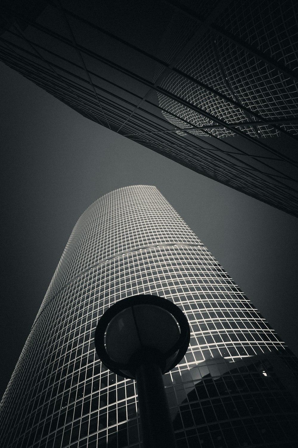 a lamp post in front of a large building