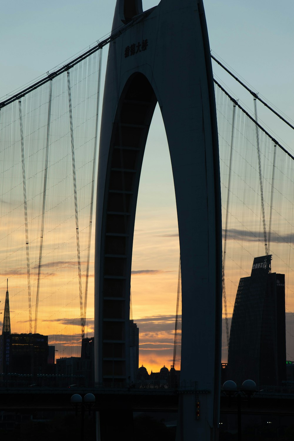 a large bridge with a sunset