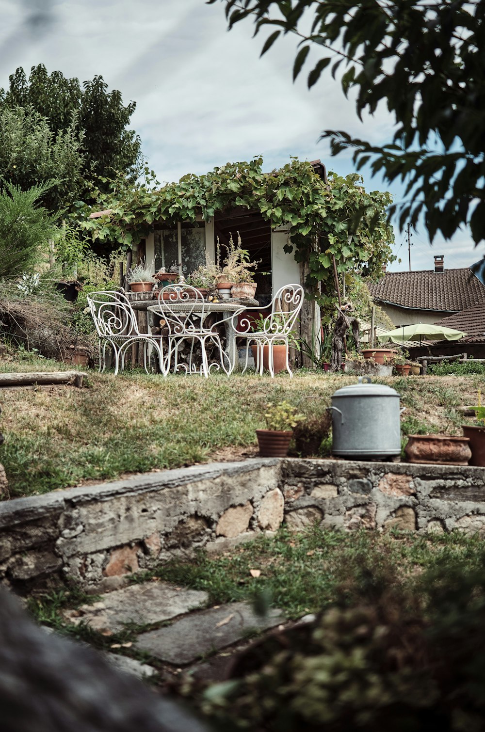 a backyard with a table and chairs