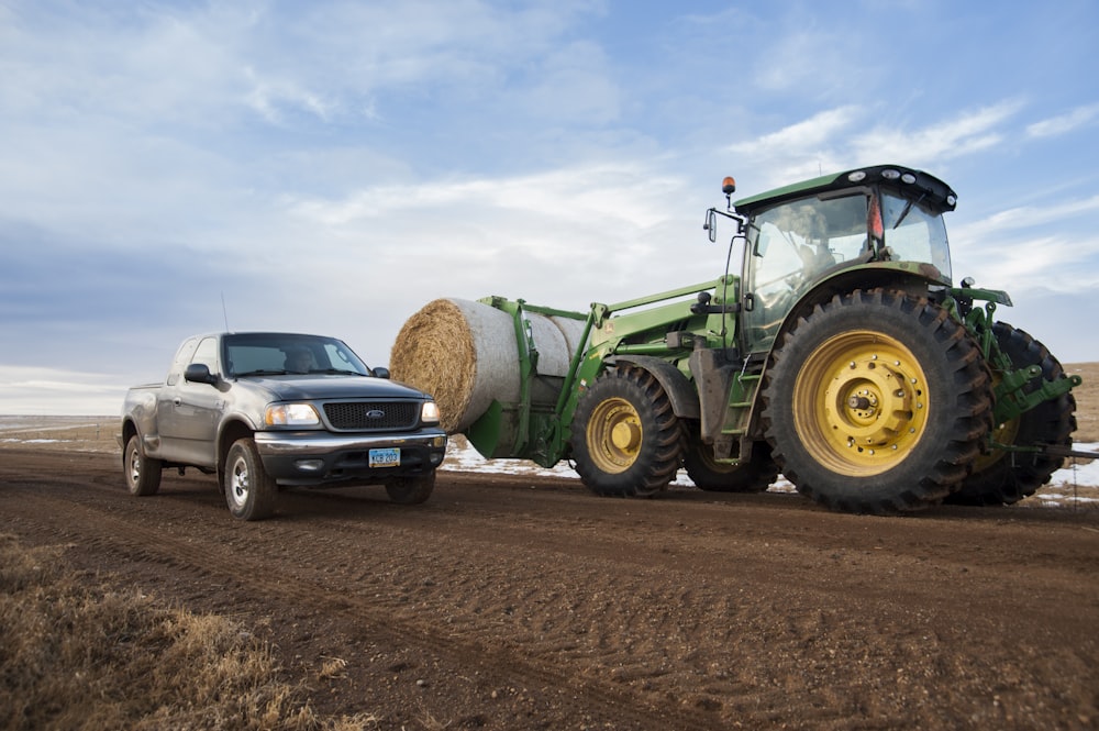 a tractor pulling a car