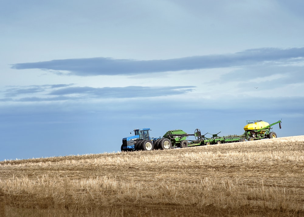 a few tractors in a field