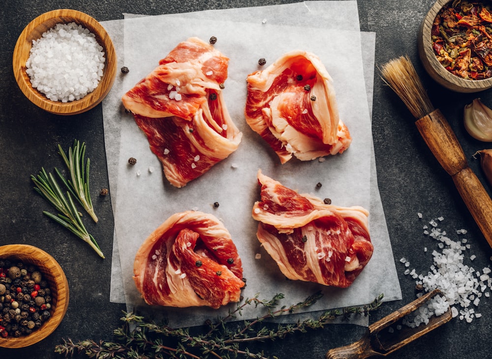 a group of raw fish on a cutting board