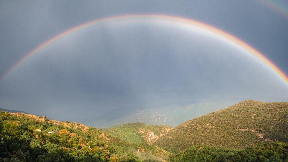 a rainbow over a mountain