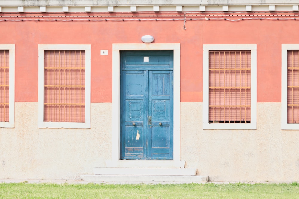 a red building with a blue door
