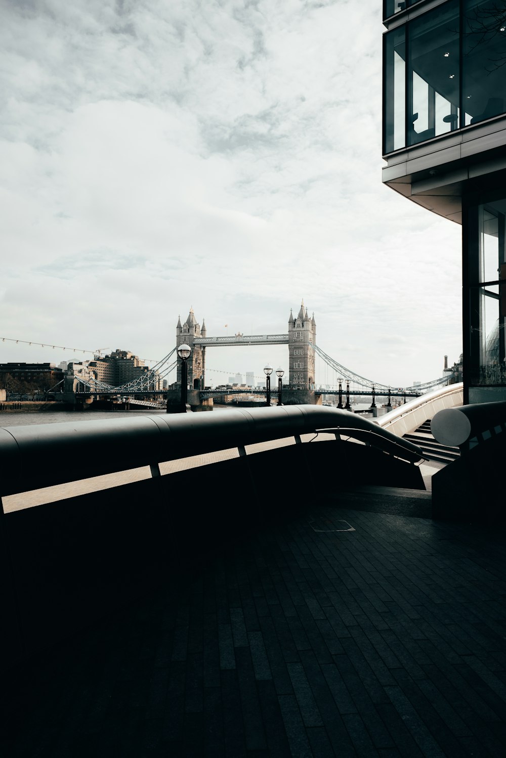 a bridge with a tower in the background