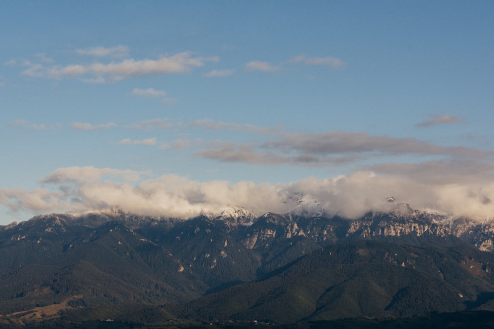 a mountain range with clouds