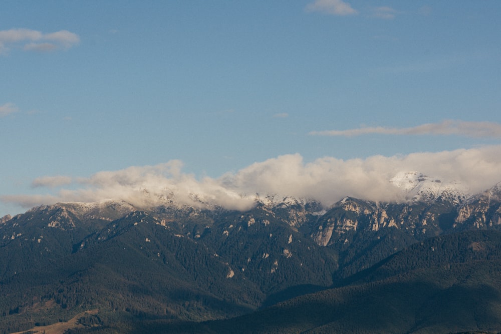 a mountain range with clouds