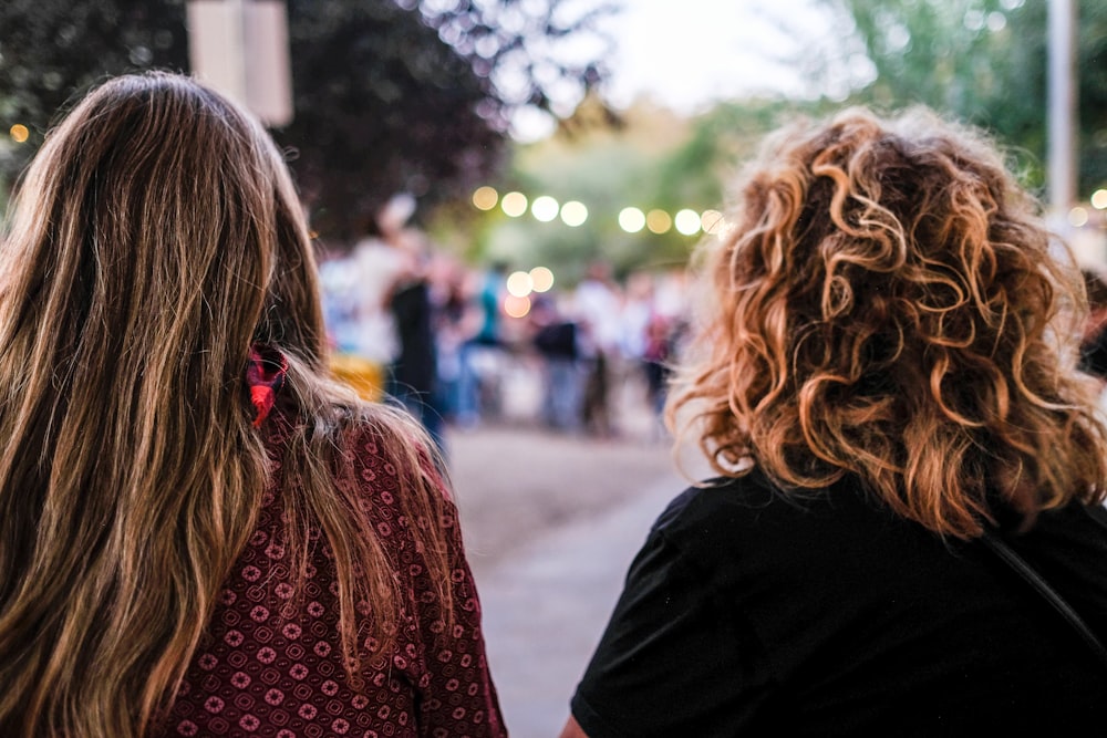 a couple of women facing each other