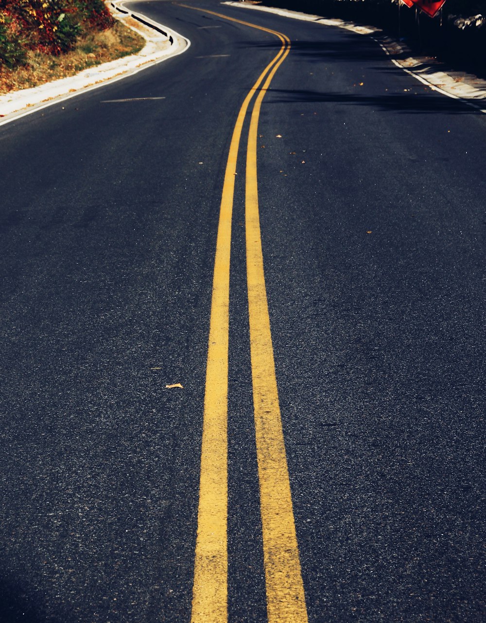 a road with yellow lines