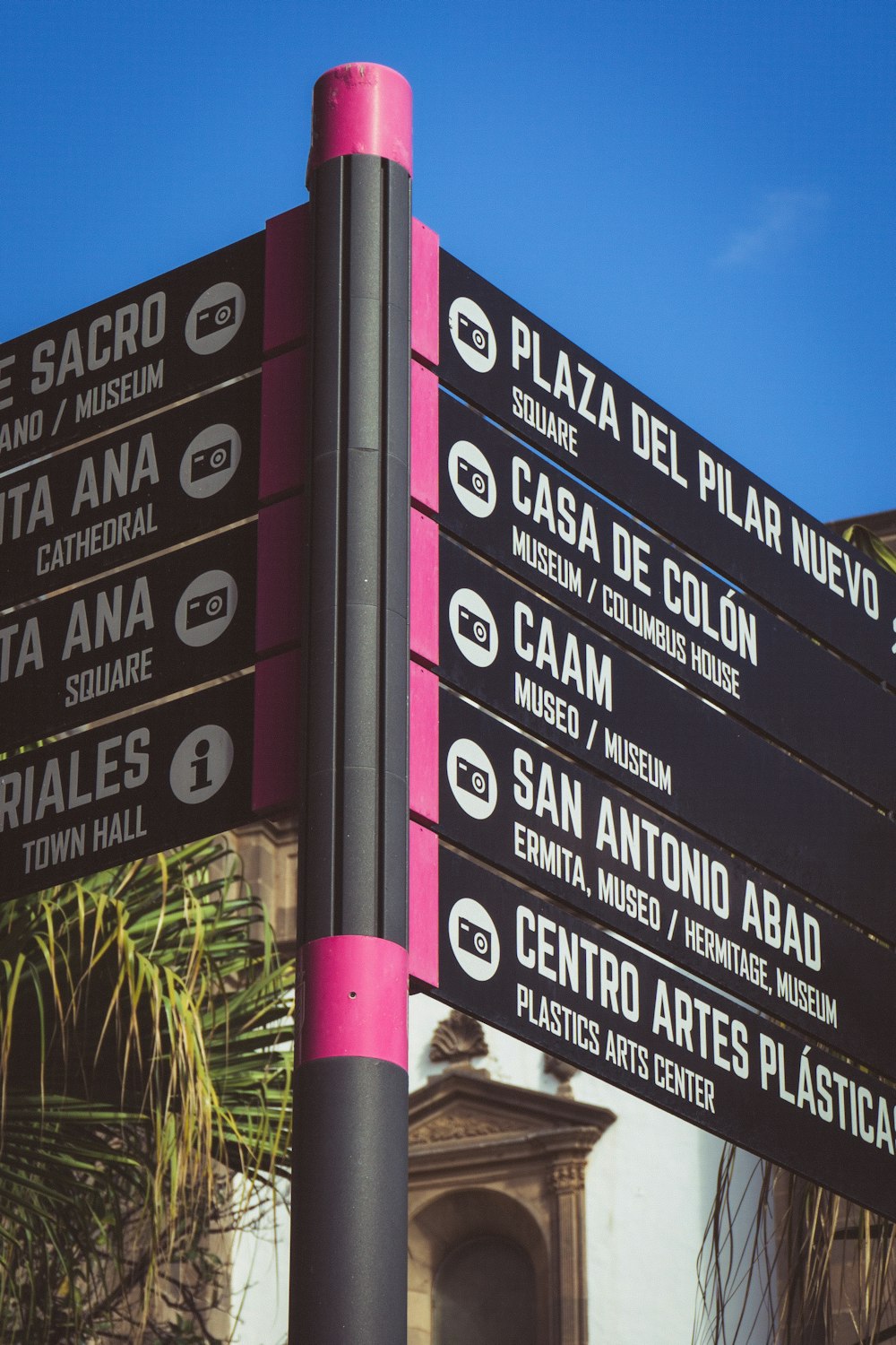 a sign board with different street signs
