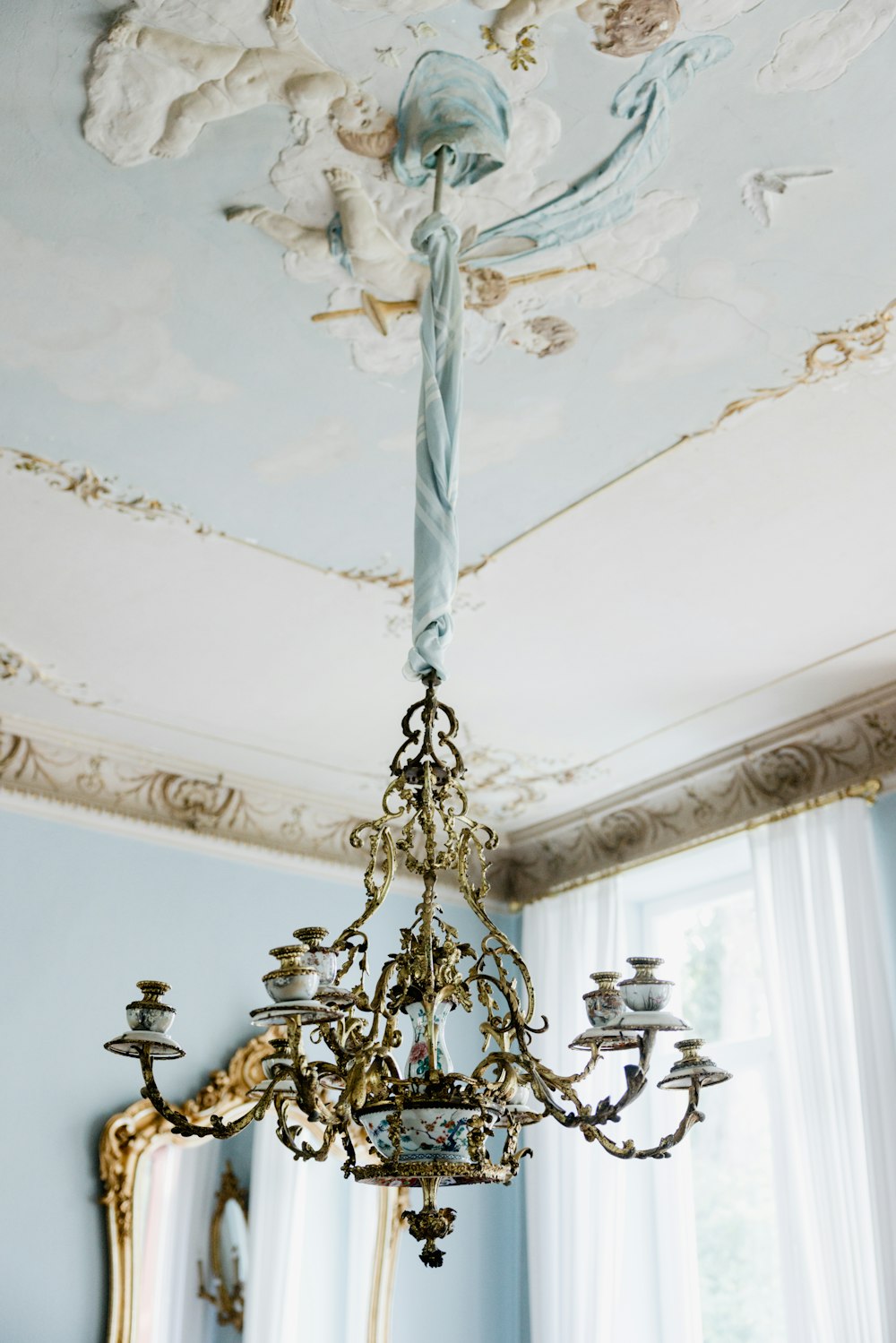 a chandelier with a skull and cross on it