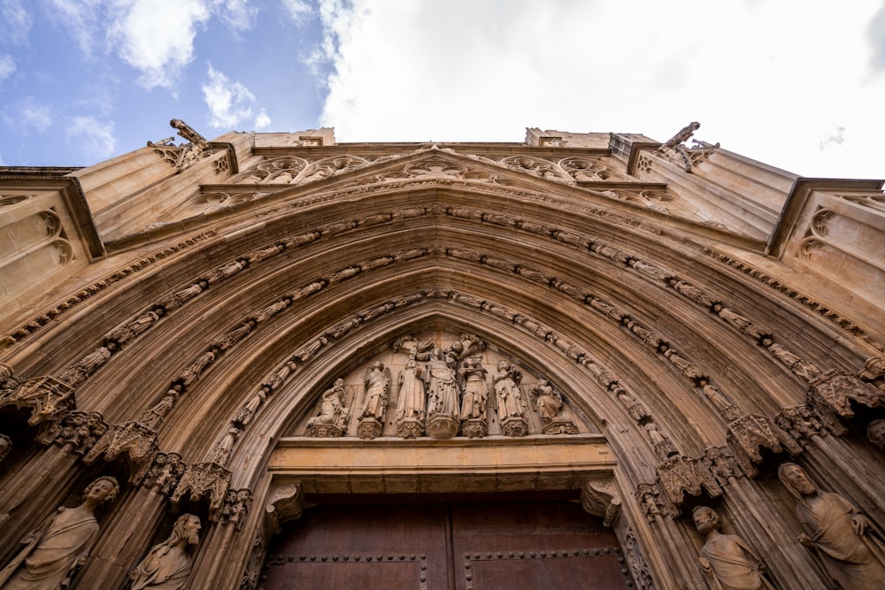 a building with statues on the roof