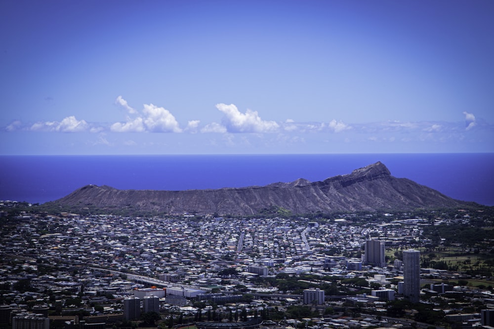 a city with a mountain in the background