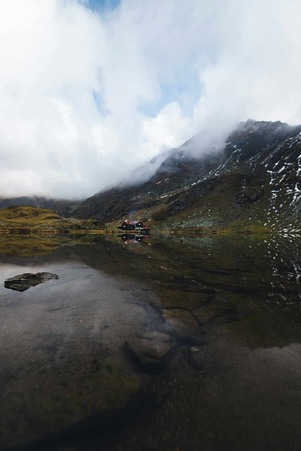 a mountain with a stream running through it