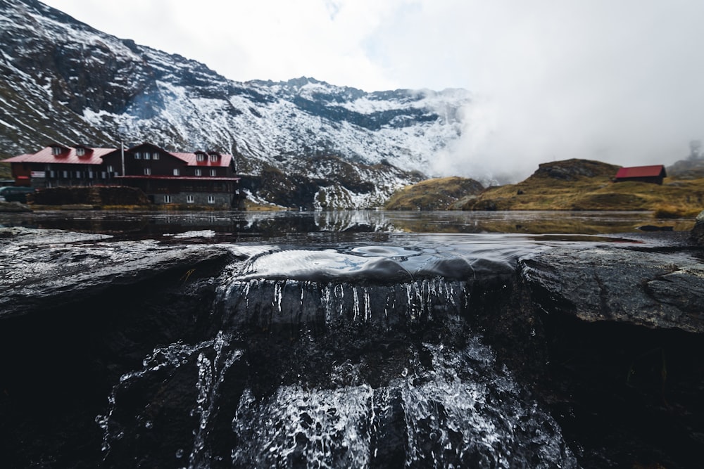 a building on a rocky shore