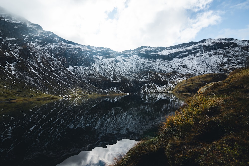 a river running through a valley between mountains