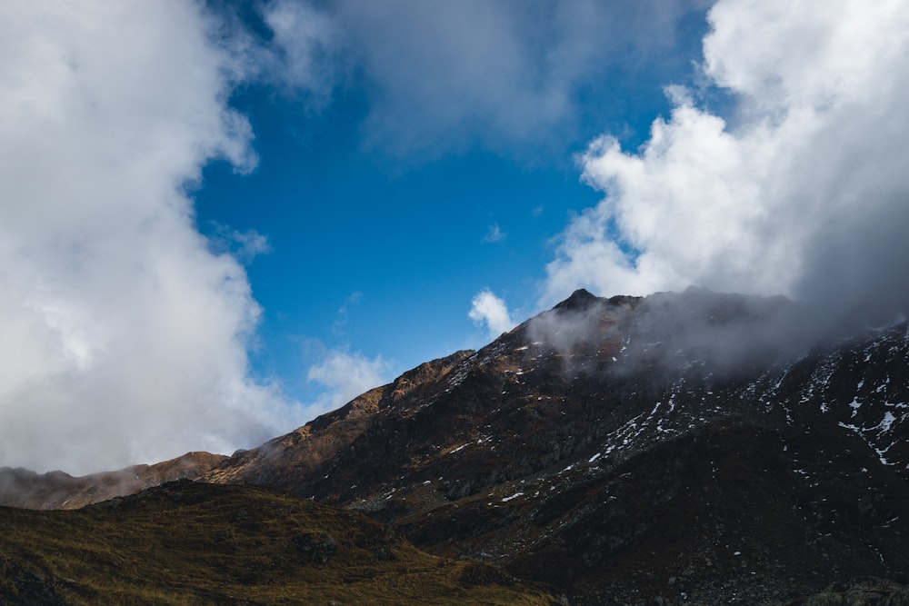 a mountain with clouds