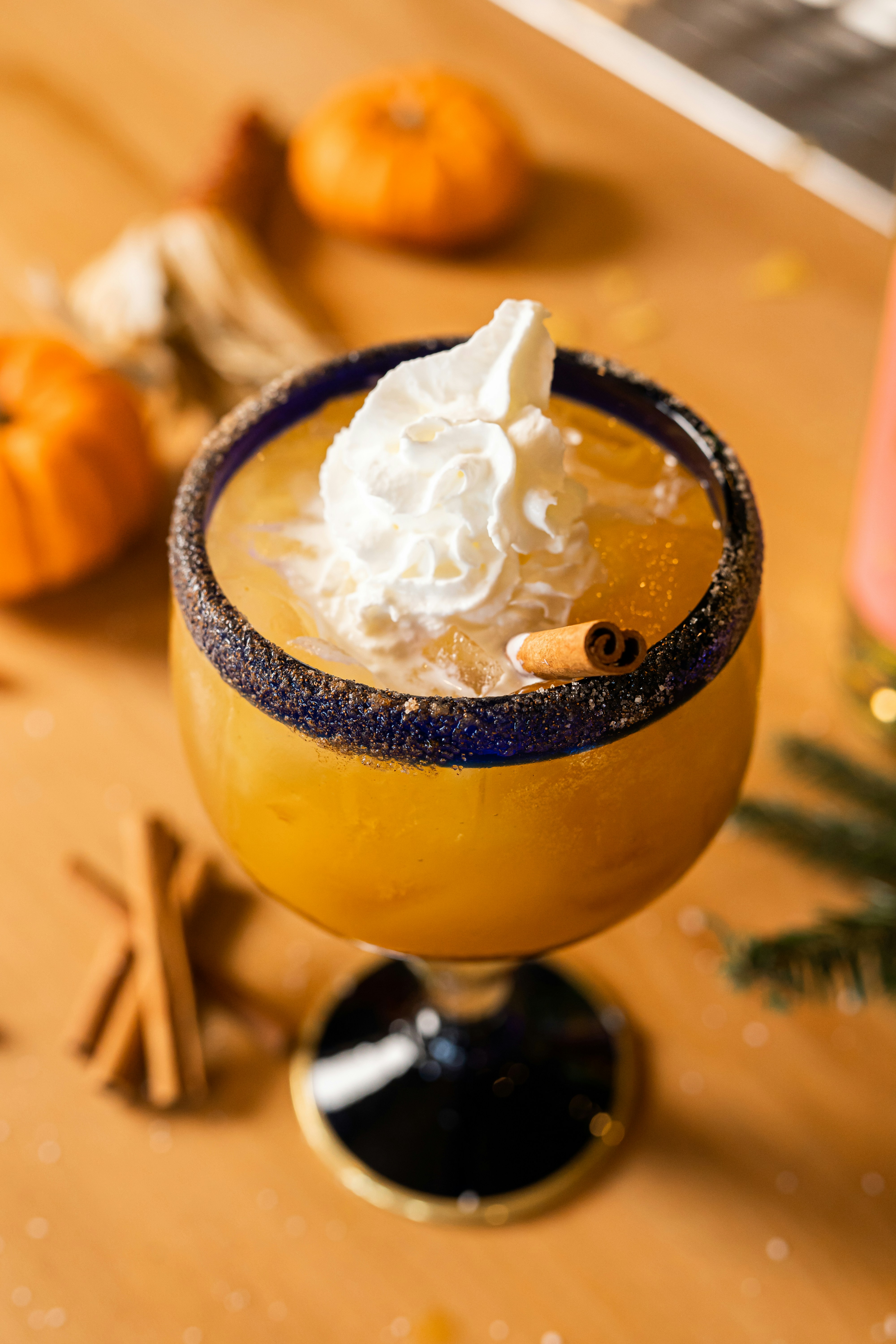 a glass of ice cream with a spoon and lemon slices on the side