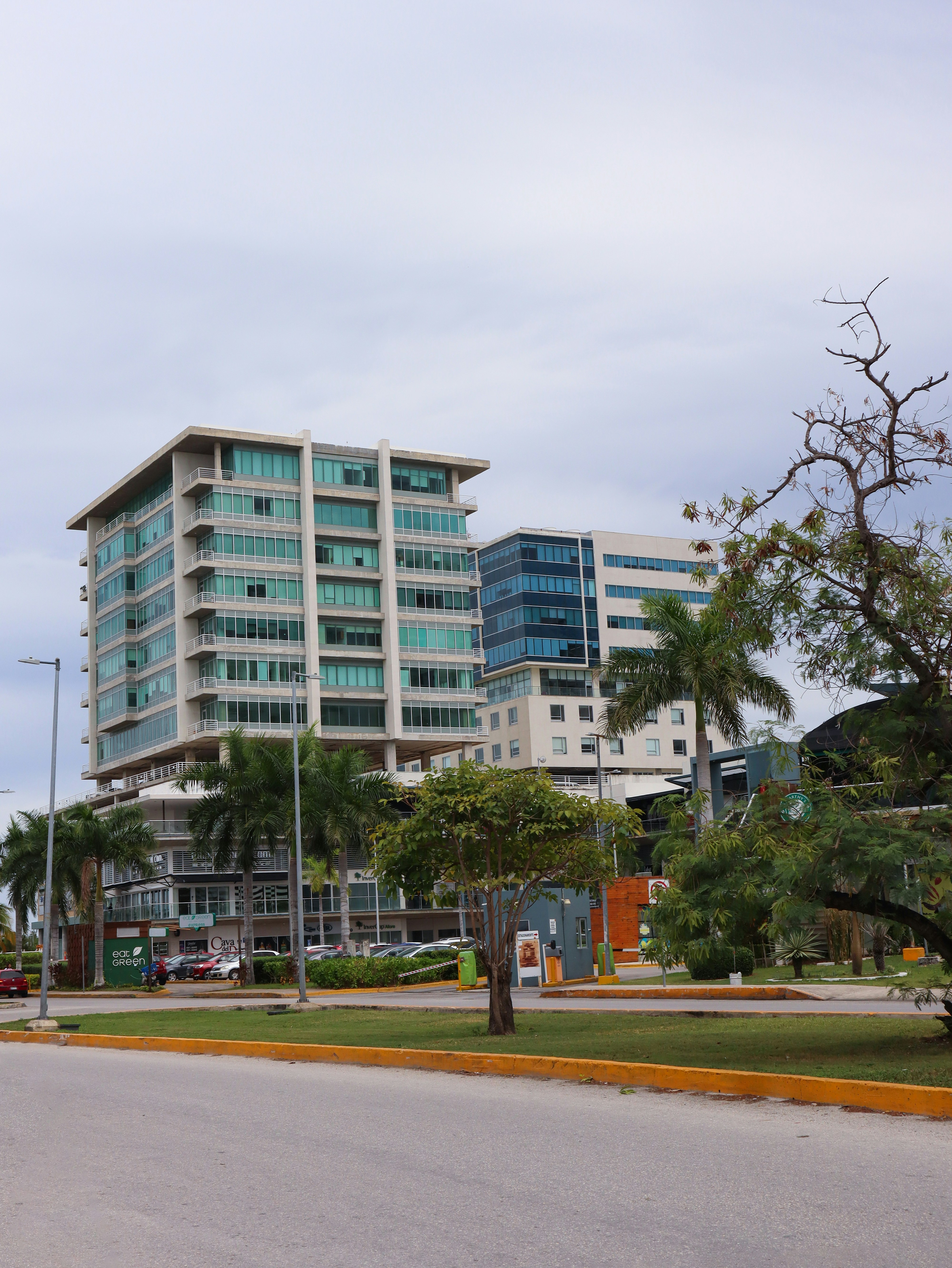 a large building with trees in front of it